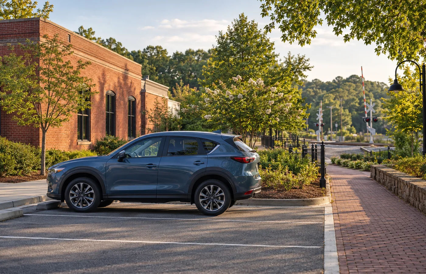 Representative Lilburn Georgia parking area with a blue crossover beside a greenway style footpath.